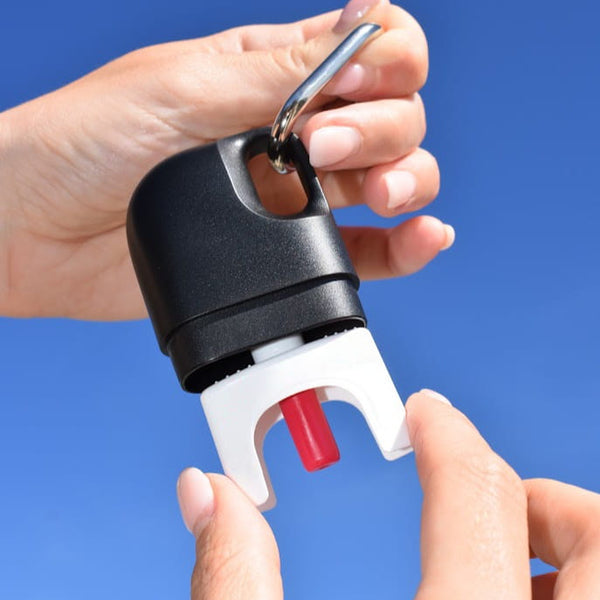 Hands separating Nove case to access nasal spray